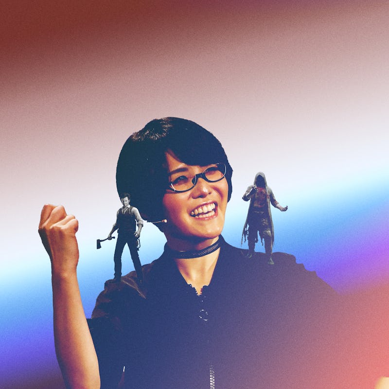 Ikumi Nakamura smiling after she won E3, with two illustrated video game characters on her shoulders