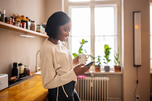 Stock image of woman using her mobile phone