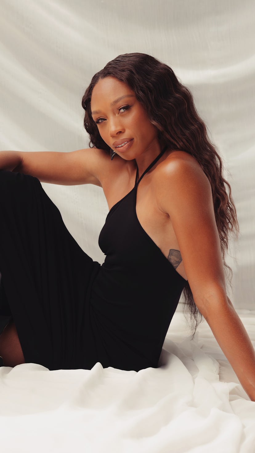 Allyson Felix, the five-time Olympian posing in a black dress