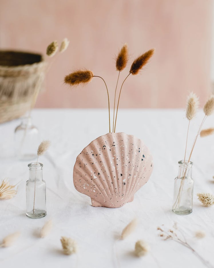 This shell vase is part of the fall 2022 home decor trends, according to experts. 