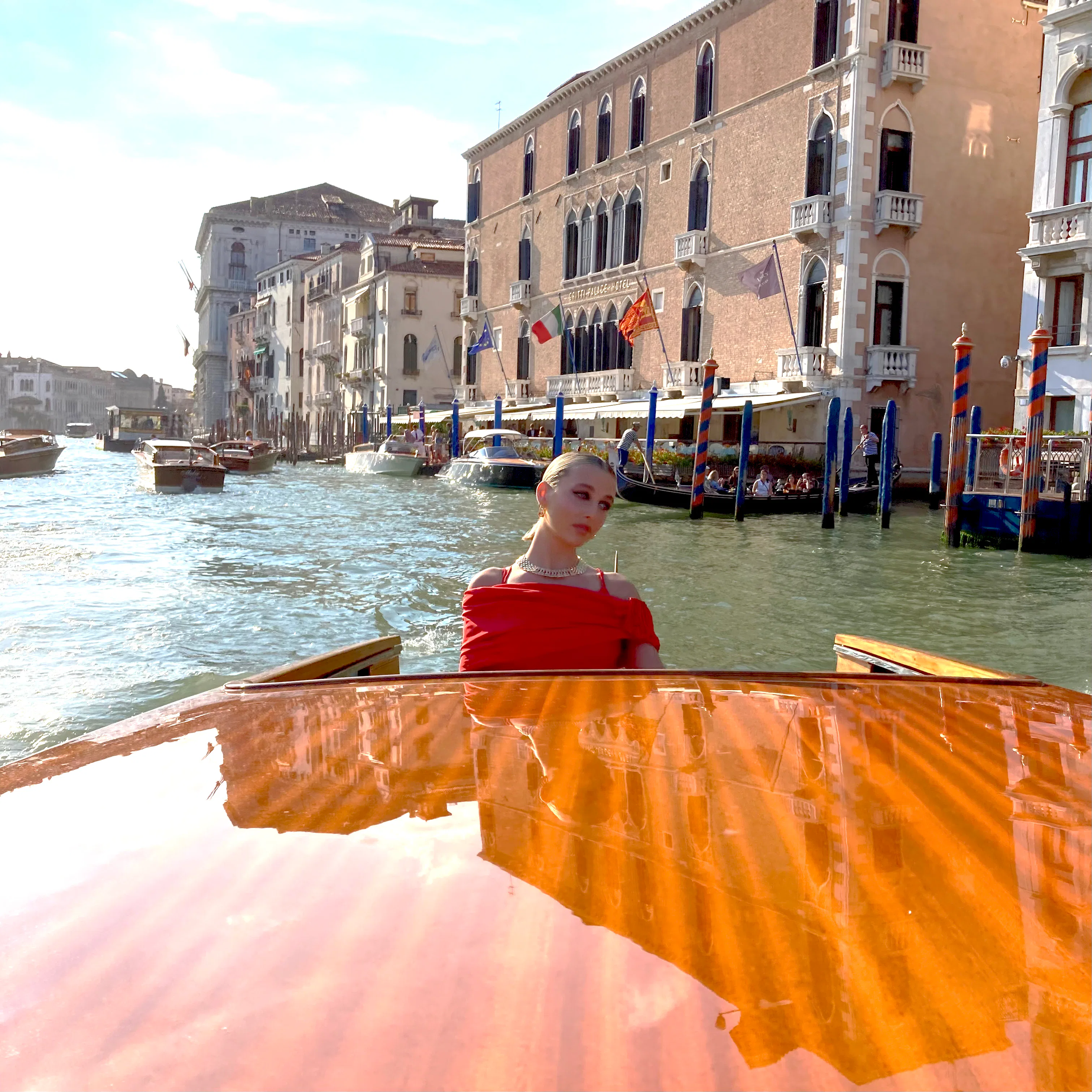 emma chamberlain red dress venice Emma Chamberlain's Venice Film Festival Diary: Cartier, Canals, and 24  Karat Gold