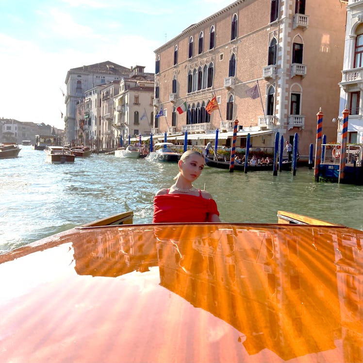Emma Chamberlain in a water taxi in Venice