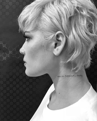Halsey has lyrics tattooed on their neck.