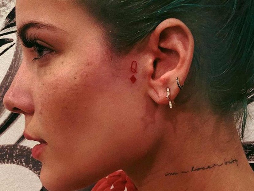 Halsey has a queen of diamonds tattoo in front of their left ear.