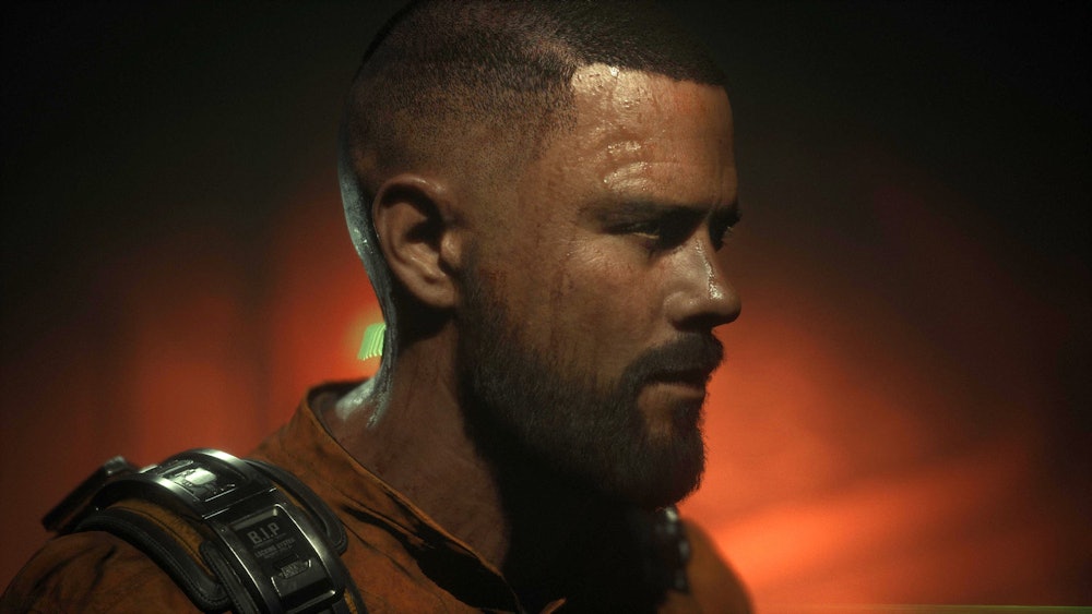 A side profile of Jacob, the protagonist of The Callisto Protocol. He is wearing an orange jumpsuit.