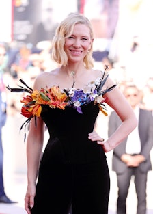 Cate Blanchett wearing a black velvet Schiaparelli corset stuffed with flowers at the Venice Film Fe...
