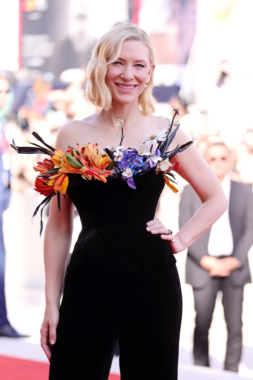 Cate Blanchett wearing a black velvet Schiaparelli corset stuffed with flowers at the Venice Film Fe...