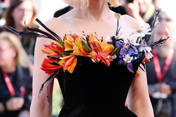 A closeup of Cate Blanchett's Schiaparelli couture stuffed with flowers at the Venice Film Festival