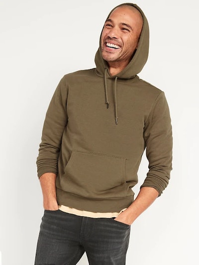 A young man in an olive pullover sweatshirt in an article about old navy labor day sales