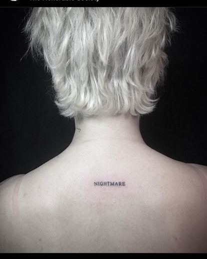 Halsey has the word "nightmare" tattooed on their back.