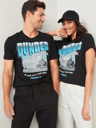 A young couple wearing a dunder mifflin shirt from the office in an article about old navy labor day...