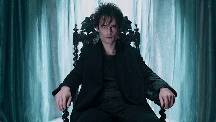 Lord of the Dreams or "The Sandman" sits in a chair