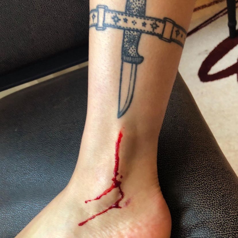 Halsey's dagger tattoo on their leg.