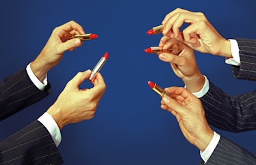 A photo of five hands holding up lipstick published in 'Toiletpaper'