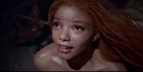 Halle Bailey as Ariel, a mermaid princess, and King Triton's youngest daughter