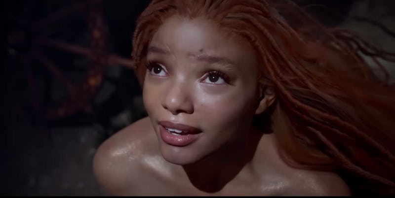 Halle Bailey as Ariel, a mermaid princess, and King Triton's youngest daughter	