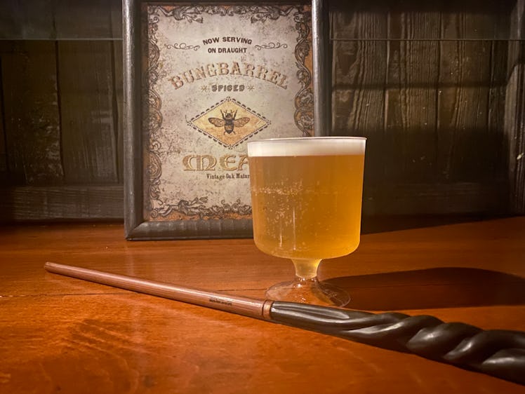 Halloween Horror Nights 2022 Death Eaters battle guests with wands and Hog's Head Inn has mead from ...
