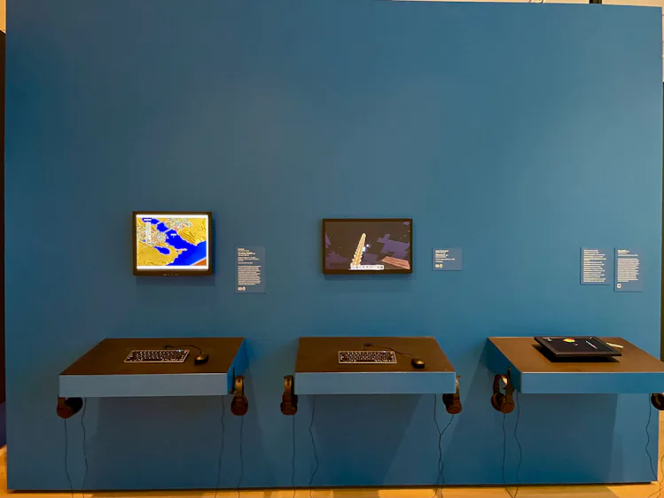 Gaming stations with Minecraft, SimCity 2000, and Biophilia running.