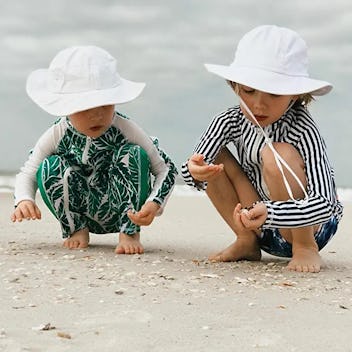 2 toddlers in white SwimZip Kid's Sun Hats