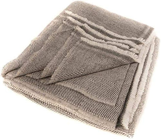 This cashmere and wool blend blanket is one of the best cashmere blankets due to its durability and ...