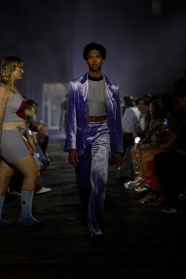 Tyler Mitchell wearing a lilac suit as he walks Marni's NYFW show