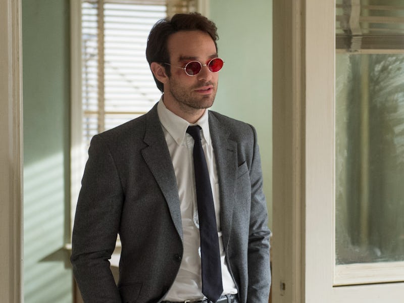 Charlie Cox wears a suit and red glasses as Matt Murdock in 'Daredevil' Season 1