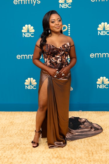  Quinta Brunson at the 74th Emmys in a custom metallic Dolce & Gabbana gown with a thigh-high slit.