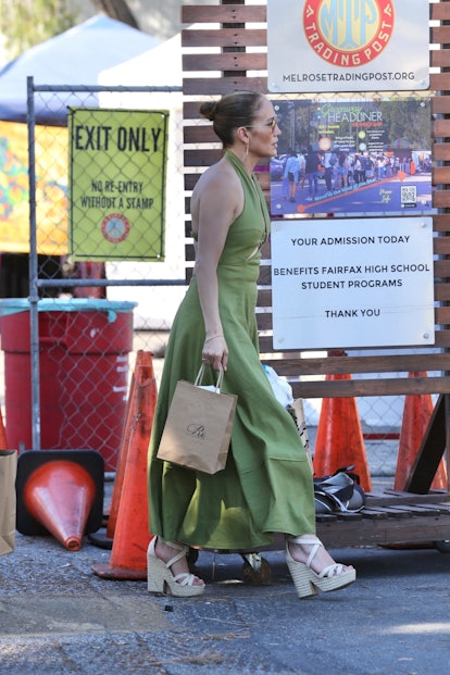 Jennifer lopez goes casual in green while shopping at the Melrose Trading Post.
