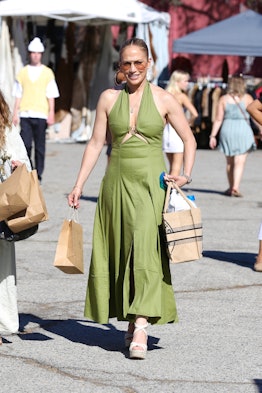 Jennifer lopez goes casual in green while shopping at the Melrose Trading Post.