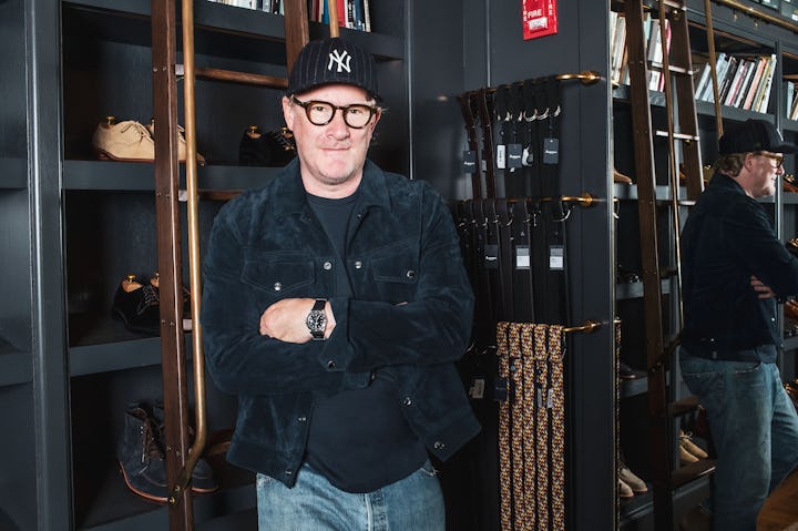 Todd Snyder standing in front of menswear products which emulate everything right with the dad style...