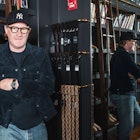 Todd Snyder standing in front of menswear products which emulate everything right with the dad style...