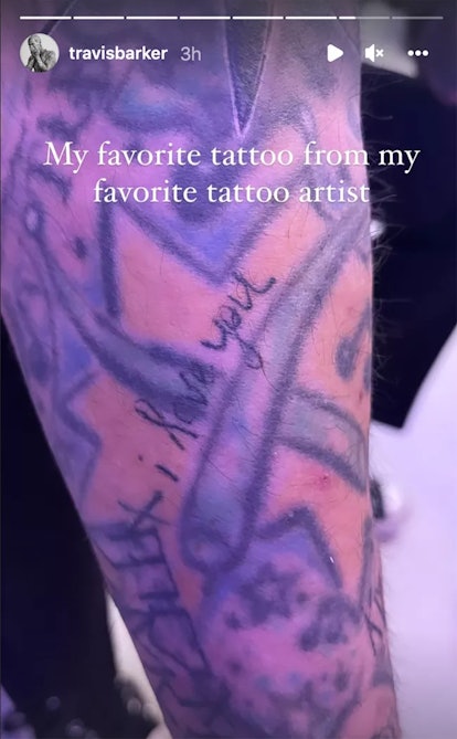 Travis Barker shows off the ink Kourtney Kardashian tattooed on him. 