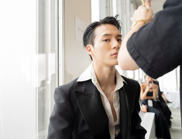 JENO getting ready backstage at the Peter Do show