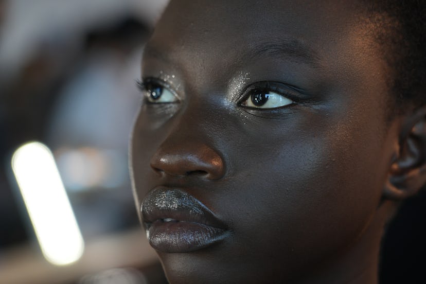 At New York Fashion Week Spring/Summer 2023, Diana Kendal created at glittery smokey eye makeup look...