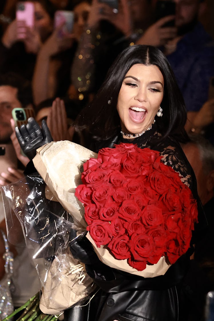 Kourtney Kardashian receiving flowers at her boohoo runway show during NYFW (aka New York Fashion We...