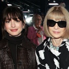 Anne Hathaway and Anna Wintour seated together at the Michael Kors Spring 2023 fashion show at New Y...