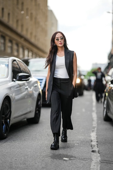 Chriselle Lim wears black sunglasses, silver sunglasses, a black sleeveless long blazer jacket, a be...