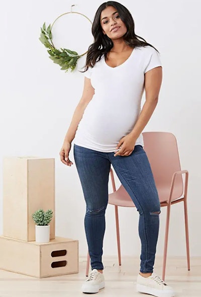 The Motherhood Maternity Short Sleeve Side Ruched V-Neck Tee Shirt in White is one of the best mater...