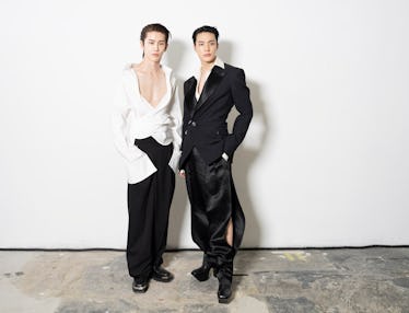 Jeno and Shohei taking pics before walking the runway