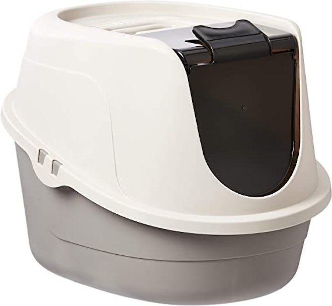 A dog-proof litter box with an entry flap.
