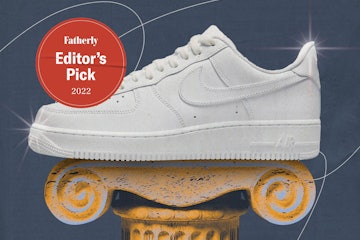 White Nike Air Force 1 sneakers on a pedastal.
