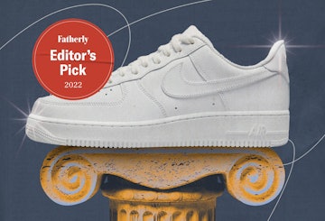 White Nike Air Force 1 sneakers on a pedastal.