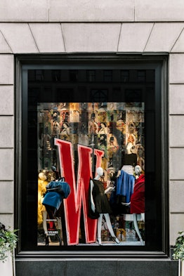 a window display at the department store bergdorf goodman featuring the logo for W magazine surround...