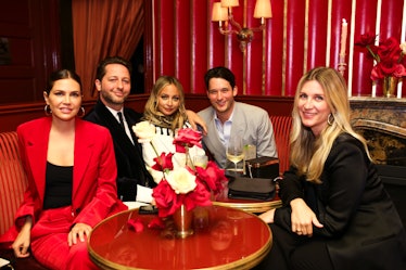 Guests at a dinner including Nicole RIchie 