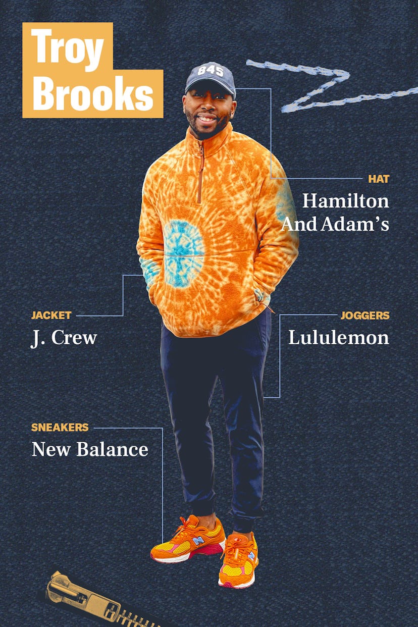 Troy Brooks in a J.Crew sweatshirt, dark blue Lululemon joggers, orange New Balance sneakers and a H...
