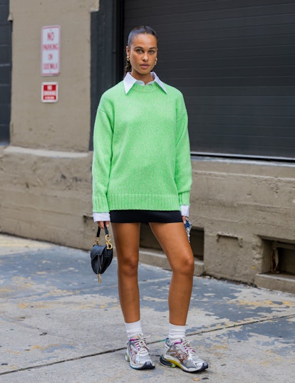 street style green sweater and mini skirt