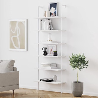 This ladder-style bookcase has open shelves and mounts to the wall.