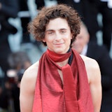 Timothée Chalamet wearing a red scarf and halter top