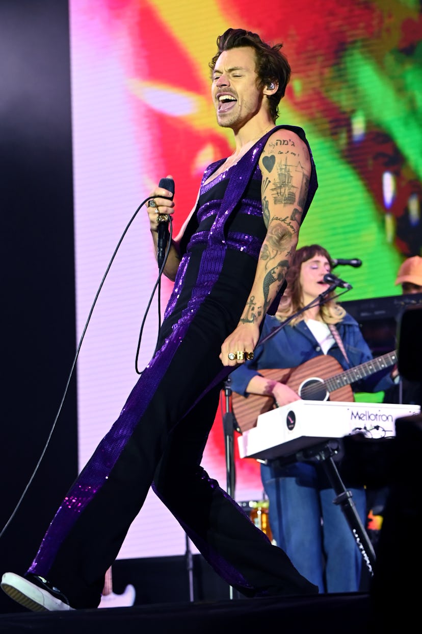 Harry styles performing on stage