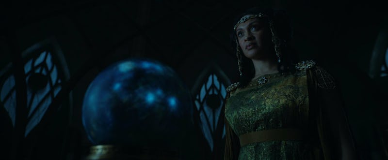 Míriel (Cynthia Addai-Robinson) stands in front of a palantír in The Lord of the Rings: The Rings of...